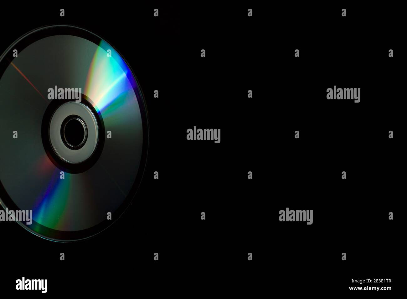 compact-disc in hand on a black background Stock Photo