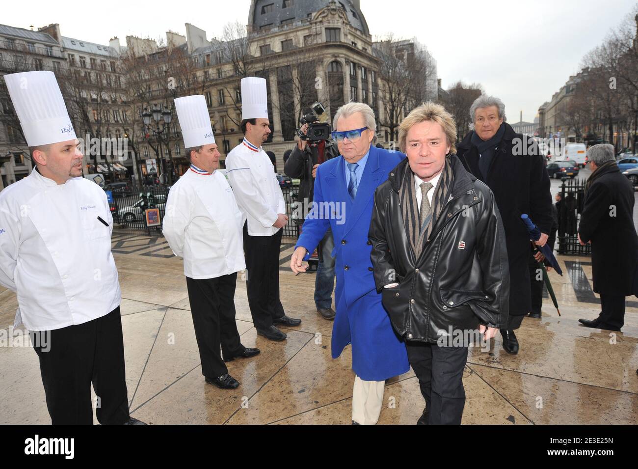 Michou and Yvan arriving at the tribute to French master pastry chef Gaston Lenotre during a mass at the Madeleine church in Paris, France on January 13, 2009. Gaston Lenotre, who built a worldwide empire with his gourmet dessert creations that defined modern patisserie, died on January 8, 2009 at the age of 88. Photo by Mousse/ABACAPRESS.COM Stock Photo