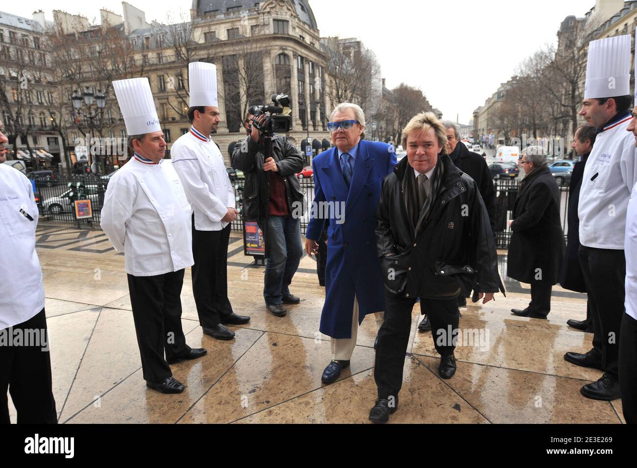 Michou and Yvan arriving at the tribute to French master pastry chef Gaston Lenotre during a mass at the Madeleine church in Paris, France on January 13, 2009. Gaston Lenotre, who built a worldwide empire with his gourmet dessert creations that defined modern patisserie, died on January 8, 2009 at the age of 88. Photo by Mousse/ABACAPRESS.COM Stock Photo