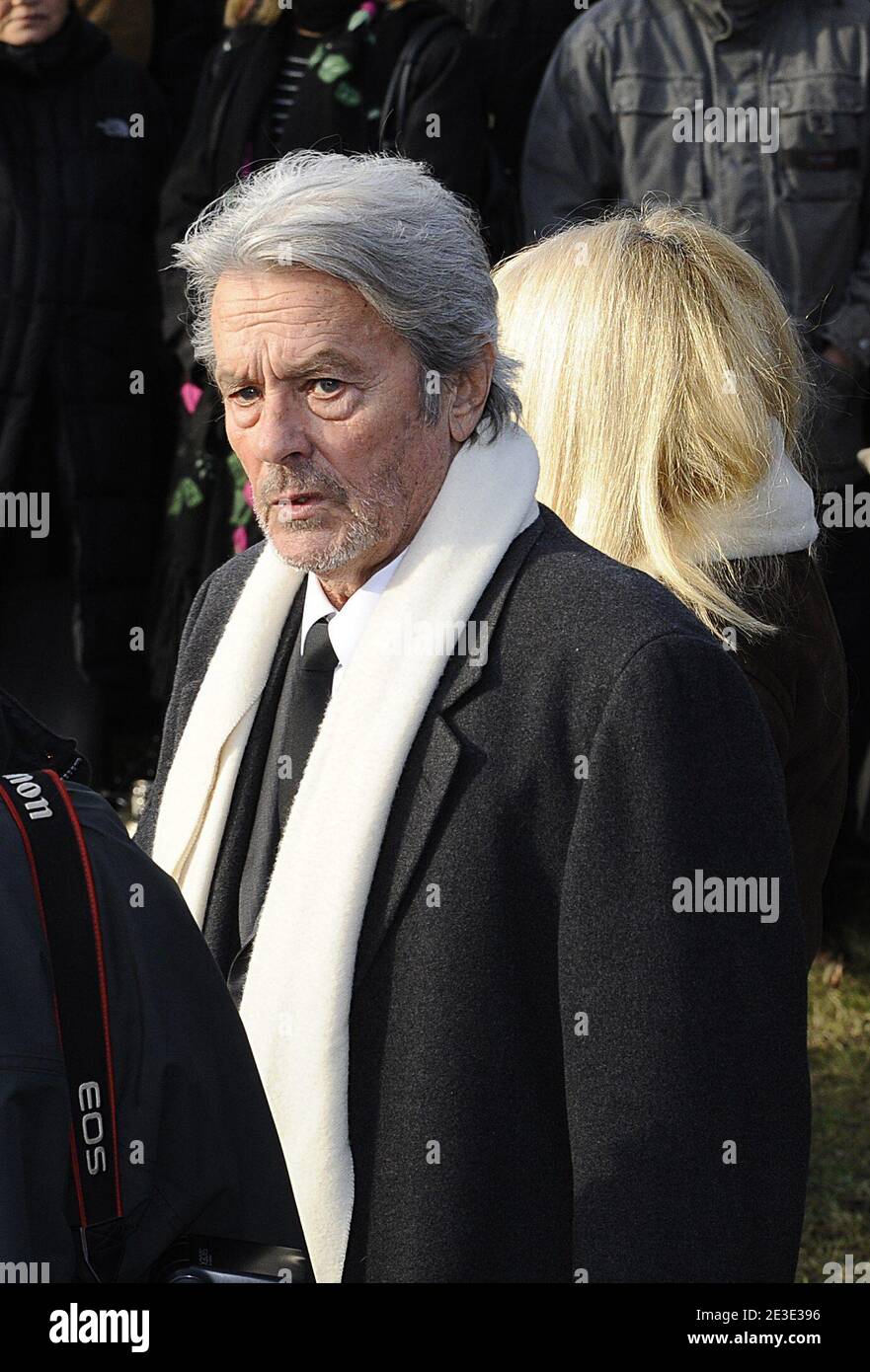 Alain Delon and Mireille Darc attending the funeral ceremony of French  producer, director and actor Claude Berri at Bagneux cemetery's jewish  district near Paris, France on January 15, 2009. Claude Berri, a