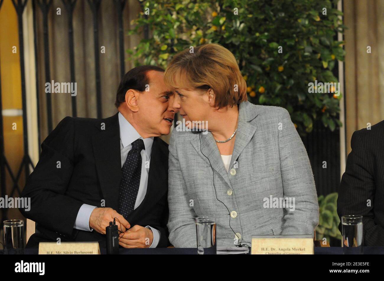 Italian Prime Minister Silvio Berlusconi is whispering to German Chancellor Angela Merkel during a joint press conference with other European leaders at the residence of Israeli Prime Minister Ehud Olmert in Jerusalem, Israel on January 18, 2009. Photo by Ammar Abd Rabbo/ABACAPRESS.COM Stock Photo