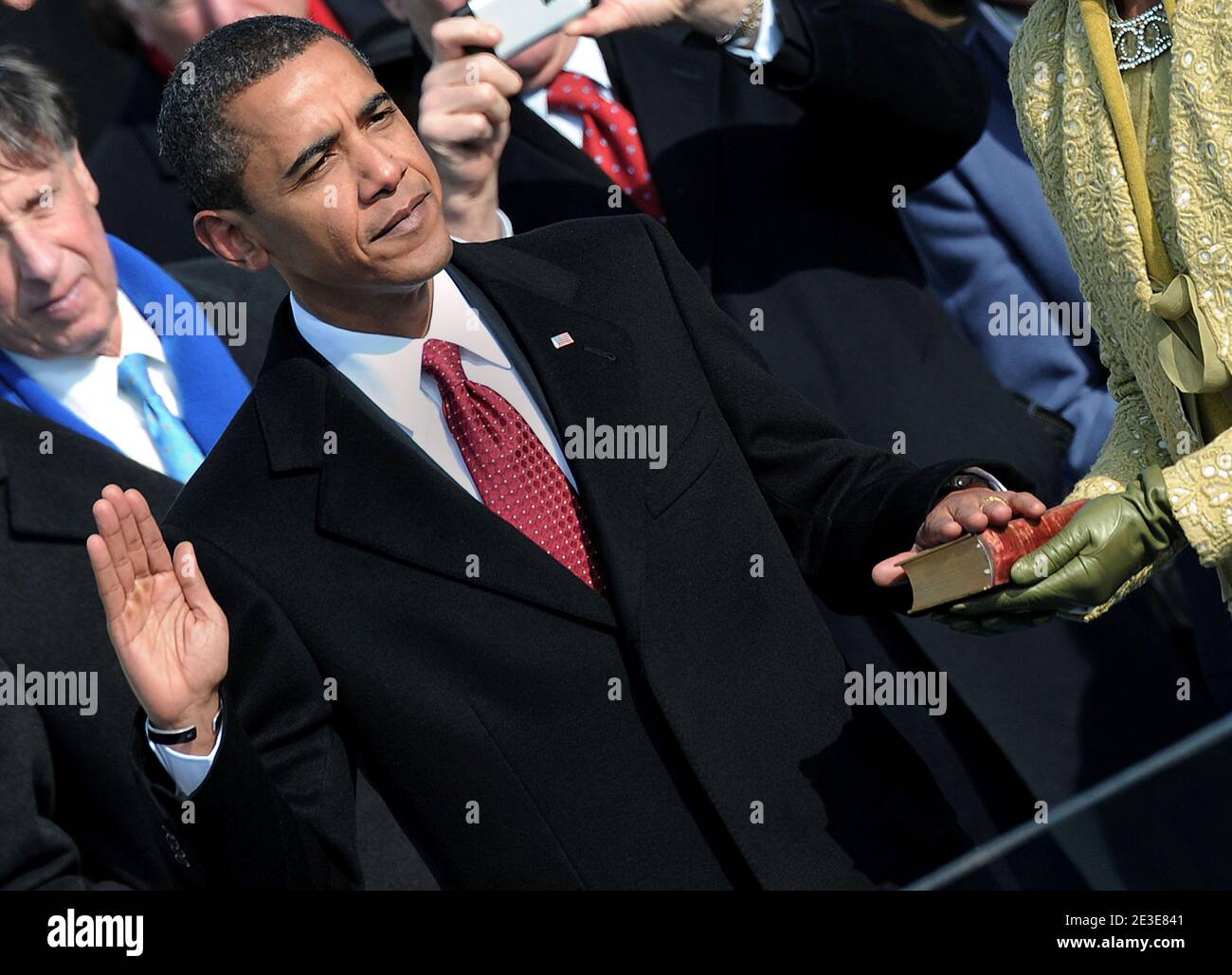 U.S. President Barack Obama along with his family, wife Michelle and daughters Malia and Sasha takes the Oath of Office from Supreme Court Chief Justice John Roberts to become the 44th U.S. President and the first African-American elected, during the Inauguration ceremonies on Capitol Hill in Washington, D.C., USA on January 20, 2009. Photo by Douliery/Hahn/ABACAPRESS.COM Stock Photo