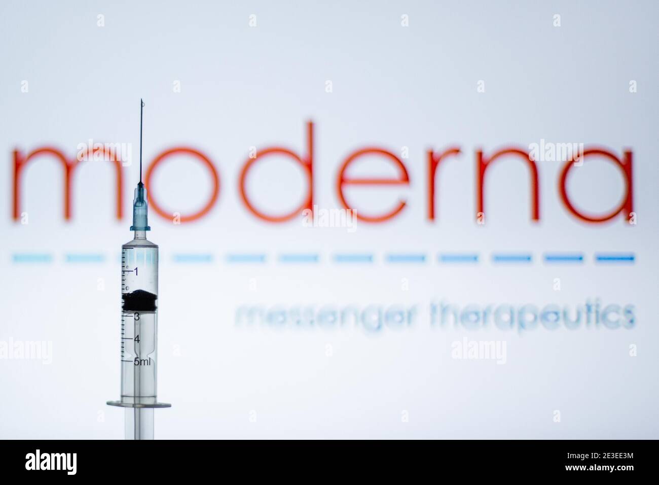 Spain. 18th Jan, 2021. In this illustration, a syringe is seen in front of the Moderna logo.Spain begins to administer the second dose of the Pfizer and BioNTech drug vaccine and the first dose (35,700 doses) of Moderna's drug has been incorporated, which also requires two injections per person. Credit: Thiago Prudencio/SOPA Images/ZUMA Wire/Alamy Live News Stock Photo