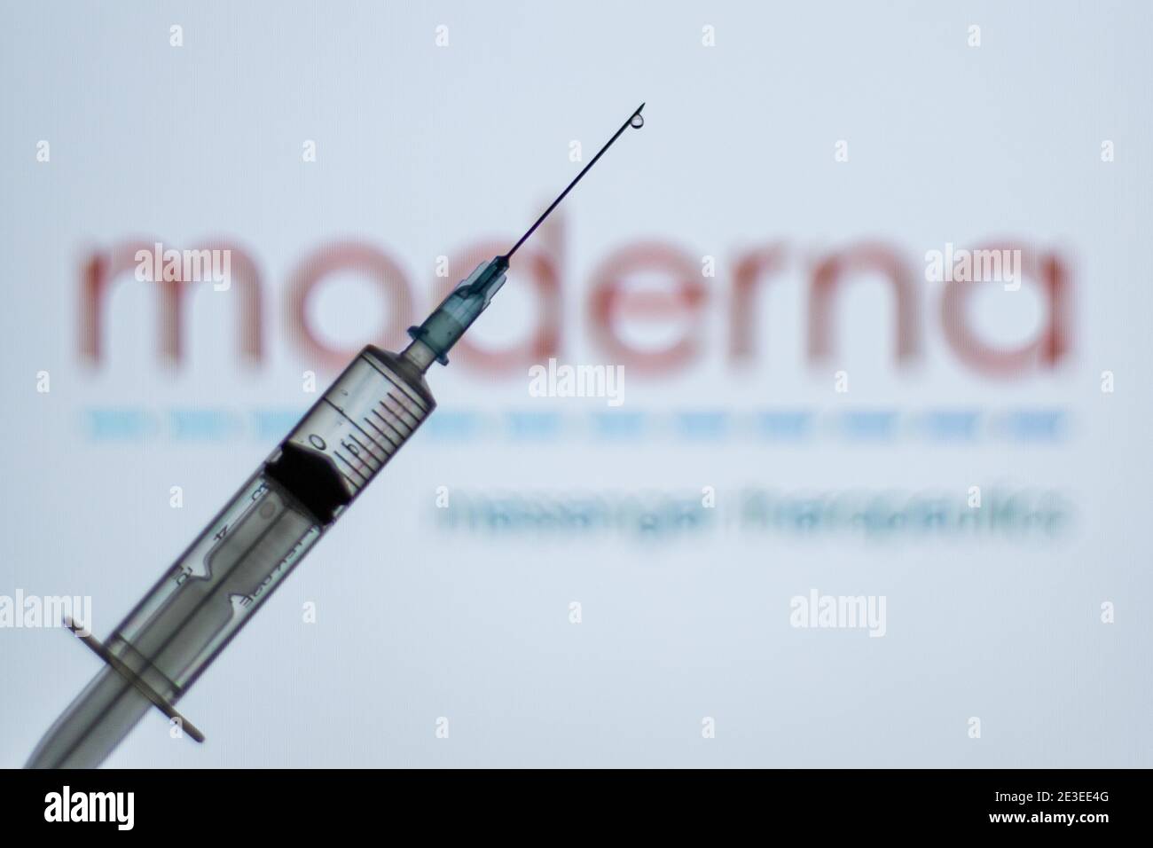 Spain. 18th Jan, 2021. In this illustration, a syringe is seen in front of the Moderna logo.Spain begins to administer the second dose of the Pfizer and BioNTech drug vaccine and the first dose (35,700 doses) of Moderna's drug has been incorporated, which also requires two injections per person. Credit: Thiago Prudencio/SOPA Images/ZUMA Wire/Alamy Live News Stock Photo