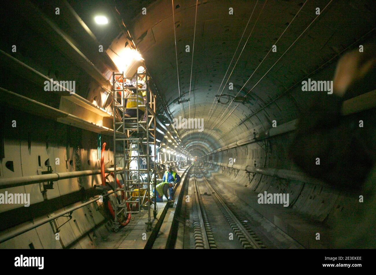 Workers repair damages in the part of the Channel Tunnel known as 'interval six' on January 28, 2009. The 50km-long north tunnel has been closed after a fire broke out on a freight shuttle travelling from Folkestone to Calais. The damaged section will reo Stock Photo