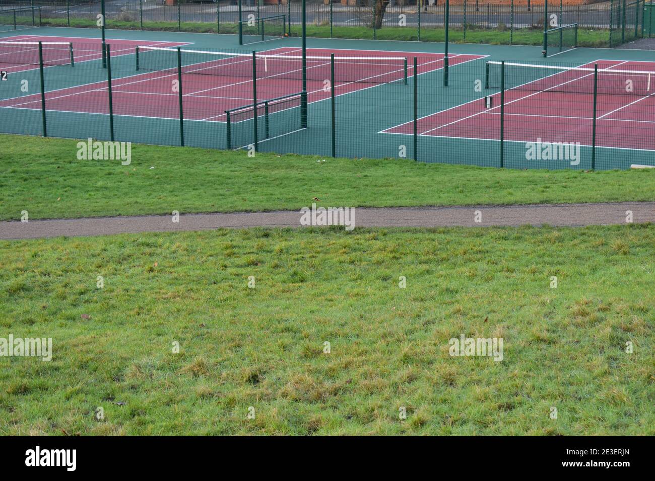 Outdoor hard tennis court which allows players to perform faster than clay but not as fast as grass Australian and US opens are played on this surface Stock Photo