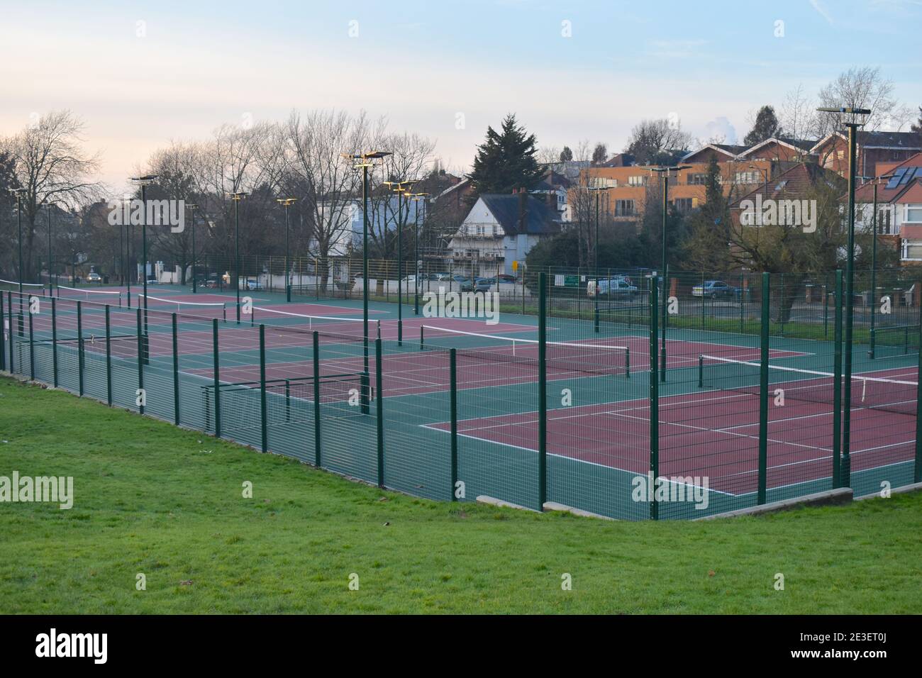 Macadam pay as you play tennis court open to the public Hard courts are made of uniform rigid material covered with acrylic for better bounce or speed Stock Photo