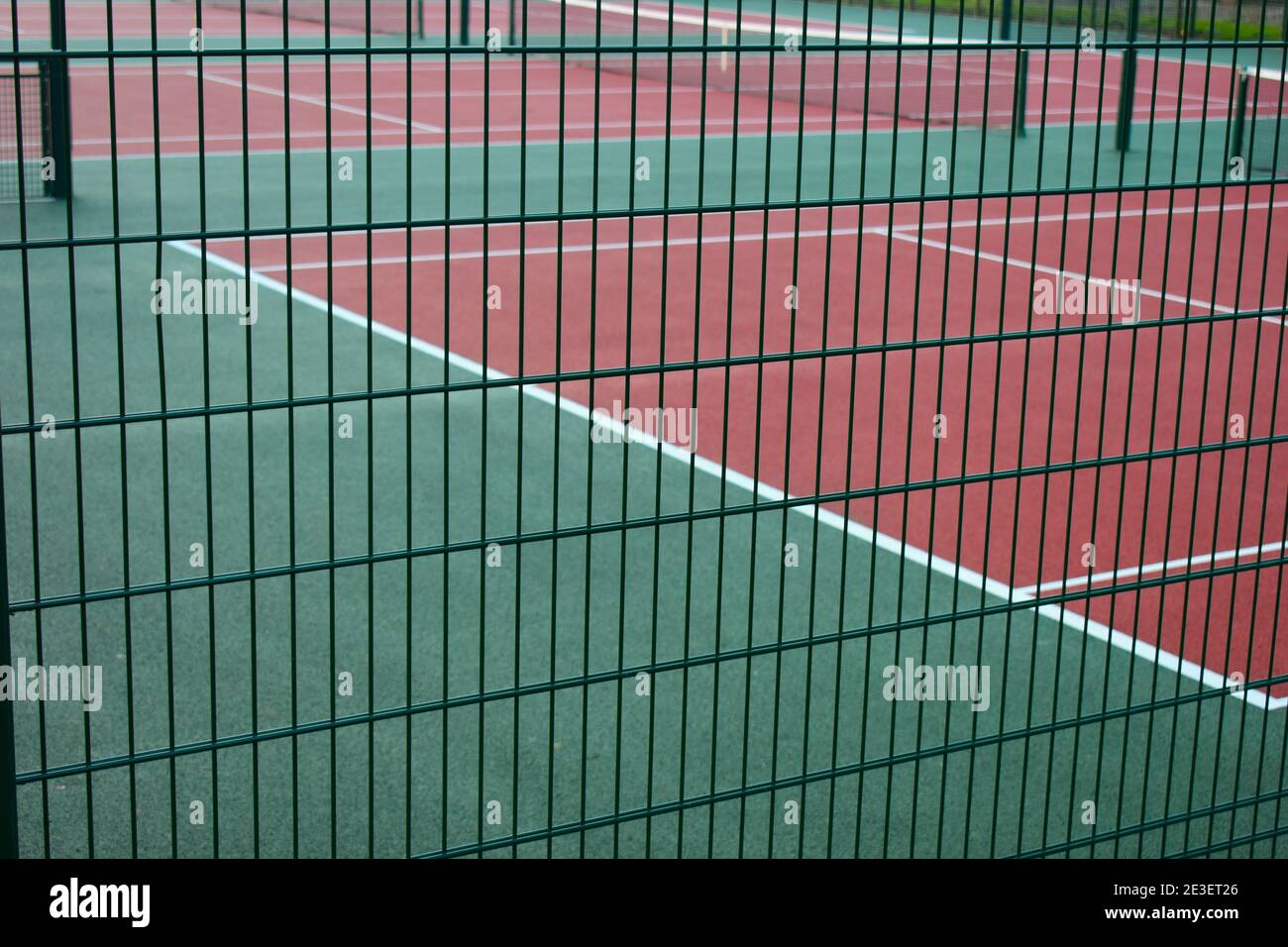 Hard tennis court is common surface for professional play It is easy maintenance best bounce allows offensive or defensive players to prove successful Stock Photo