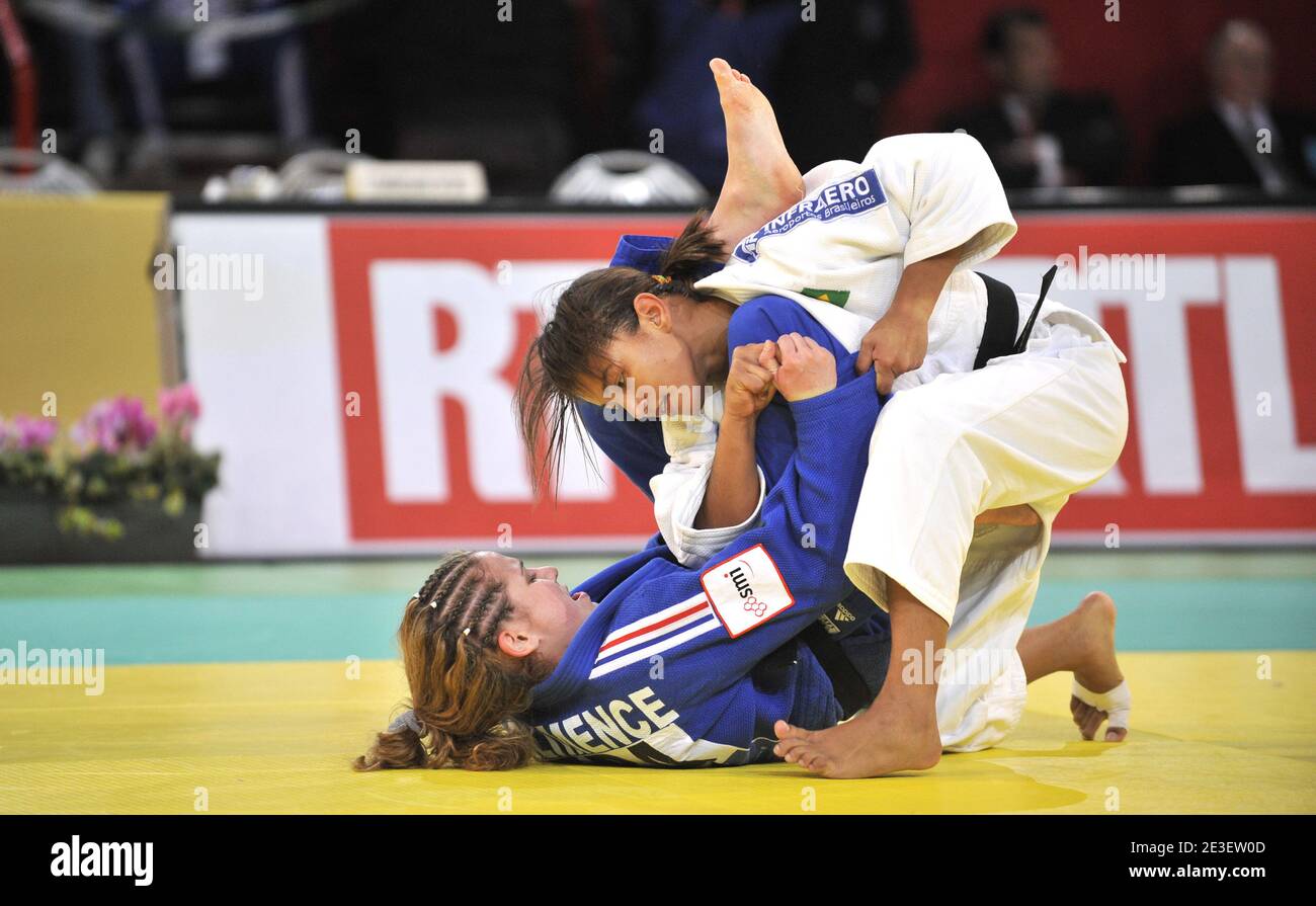 France's Aurore Climence (blue) battles with Sarah Menezes (White) in the women -48 kg category during the Judo Paris International tournament at the Bercy stadium in Paris, France on February 7, 2009. Photo by Christophe Guibbaud/Cameleon/ABACAPRESS.COM Stock Photo