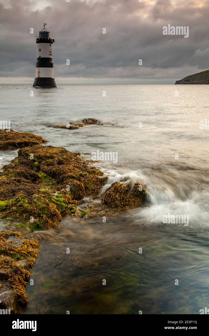 Penmon Point lighthouse on the coast of Anglesey, North Wales Stock Photo