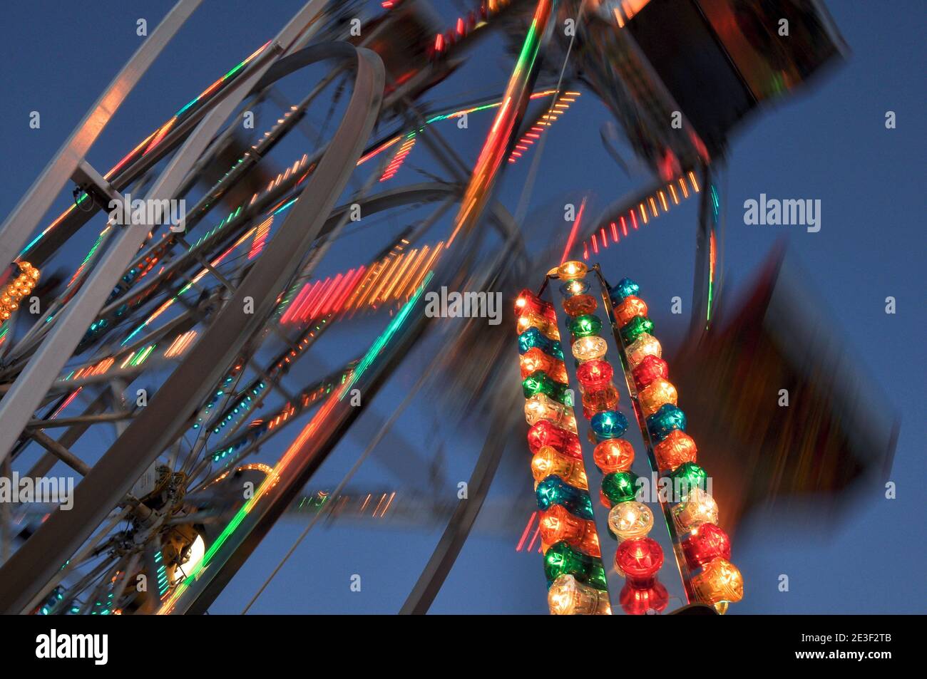 Blur motion of Ferris wheel at night Stock Photo - Alamy