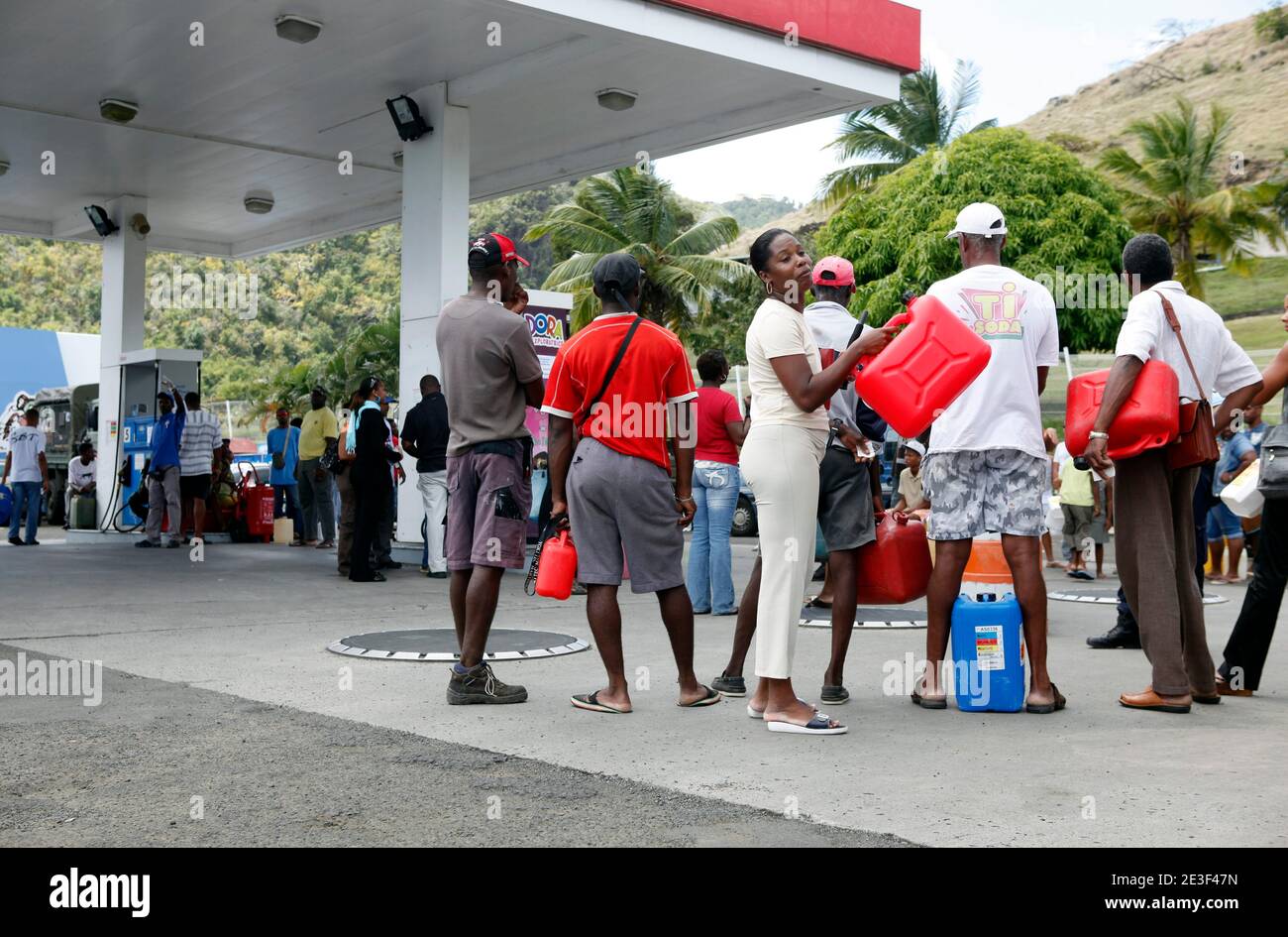 People queue up as they wait to fill up their drum in gas station in Marin, Martinique on February 17, 2009. Strikes paralysing Guadeloupe and Martinique are devastating the economies of the French Caribbean islands and causing much of the vital tourism sector there to shut down, business leaders have stated. Guadeloupe, entering its third week of a general strike, will lose about 100 million euros (130 million dollars) in a month, and economic damage was set to reach the same level in Martinique, where a similar stoppage began last week. Photo by Patrice Coppee/ABACAPRESS.COM Stock Photo