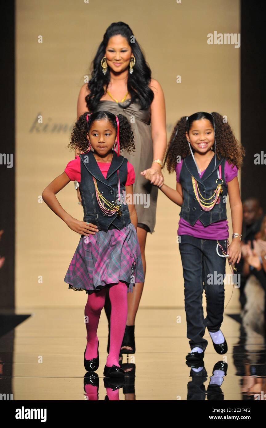 Designer Kimora Lee Simmons appears on the runway with her daughters Aoki Lee Simmons and Ming Lee Simmons at the Baby Phat show during Mercedes Benz Fashion Week Fall 2009 at Bryant Park in New York City, NY, USA on February 17, 2009. Photo by Gregorio Binuya/ABACAPRESS.COM (Pictured : Kimora Lee Simmons, Aoki Lee Simmons, Ming Lee Simmons) Stock Photo