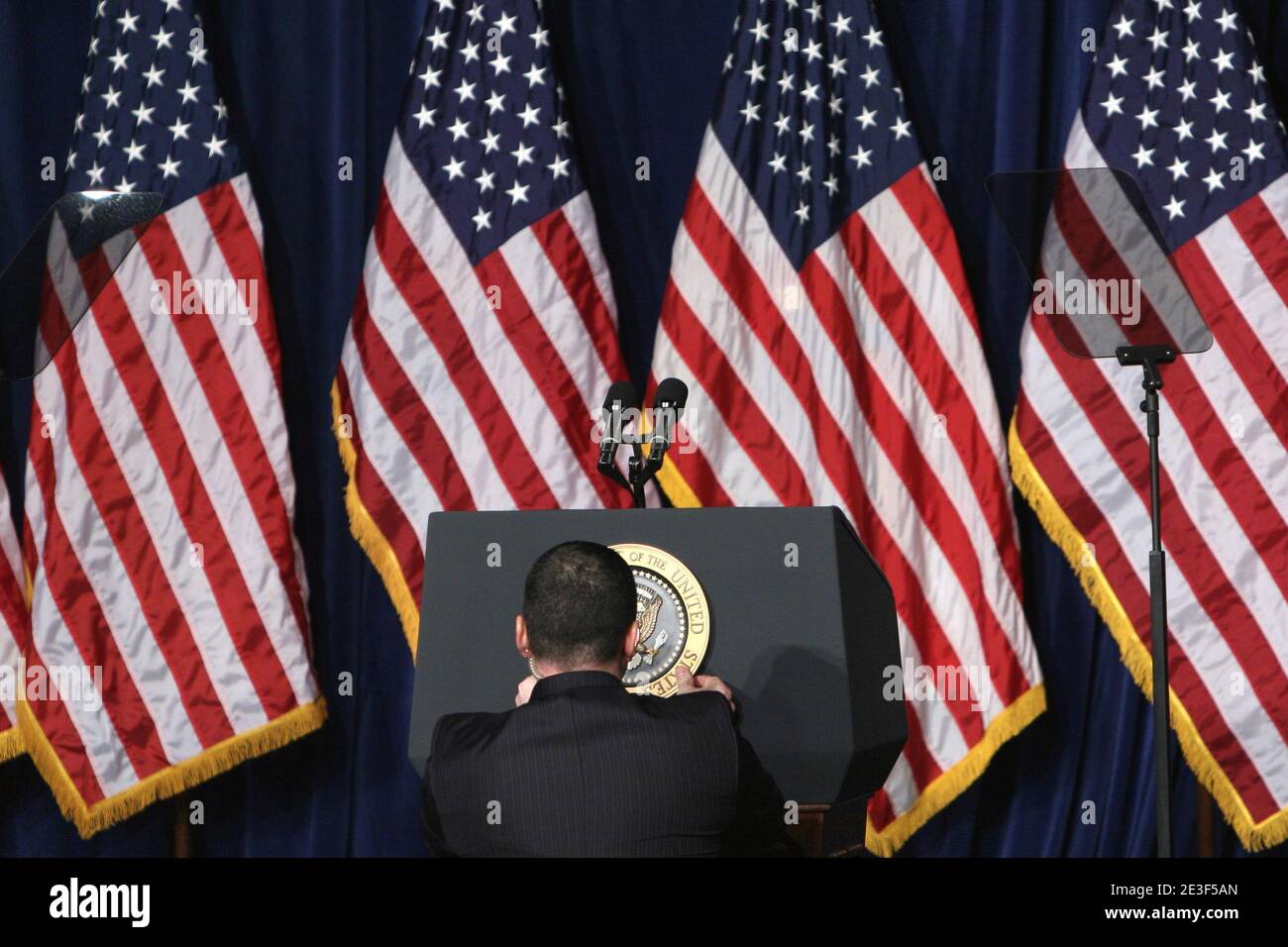 The Presidential Seal is applied to the podium before President Obama's arrival at the Dobson High school in Mesa, AZ, USA on February 18, 2009. Photo by Alexandra Buxbaum/ABACAPRESS.COM Stock Photo
