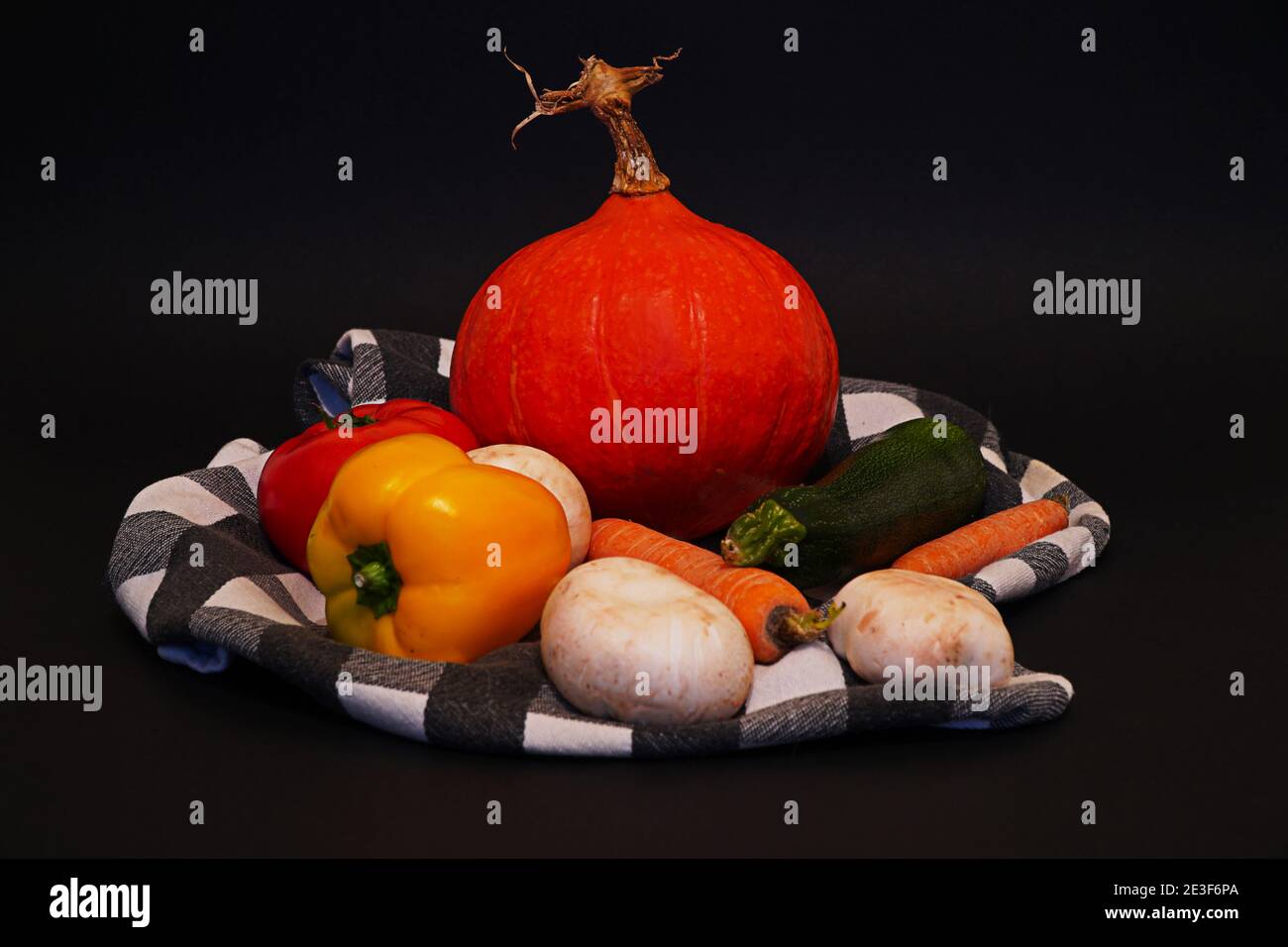 A collection of vegetables isolated against a black background Stock Photo