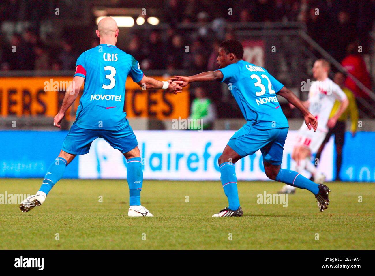 Lyon's Cris and Lamine Gassama during French First Soccer match Nancy vs Lyon in Nancy, France on February 21, 2009. Photo by Mathieu Cugnot/ABACAPRESS.COM Stock Photo