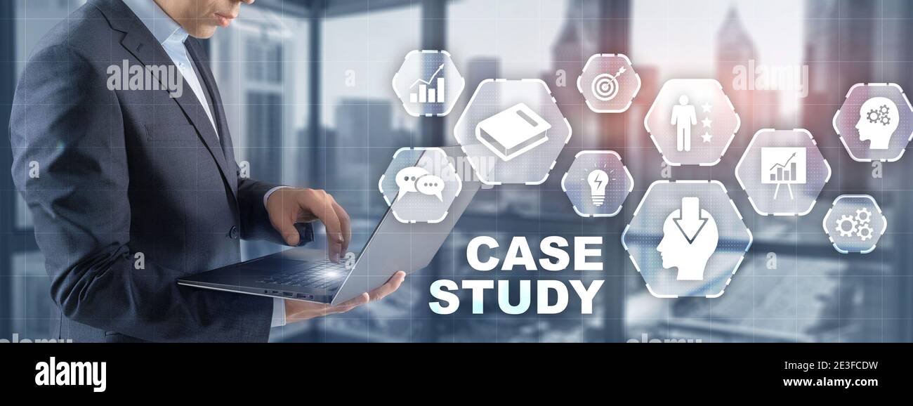 Businessman pressing case study button on virtual screens Stock Photo