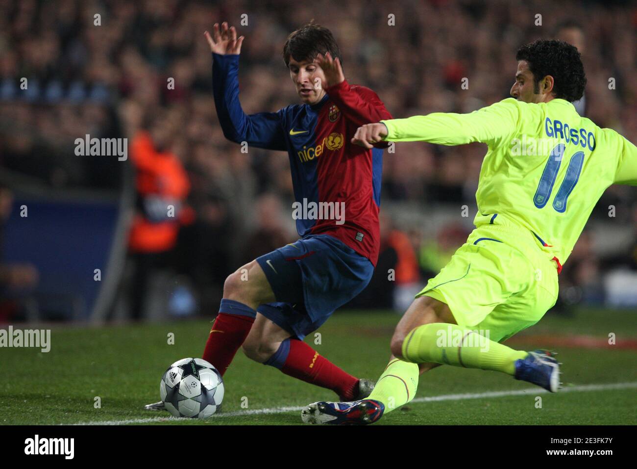 Barcelona Lionel Messi and Lyon Fabio Grosso during the Champions League  second leg first knockout round soccer match, Barcelona vs Olympique  Lyonnais at the Nou Camp, in Barcelona, Spain on March 11,