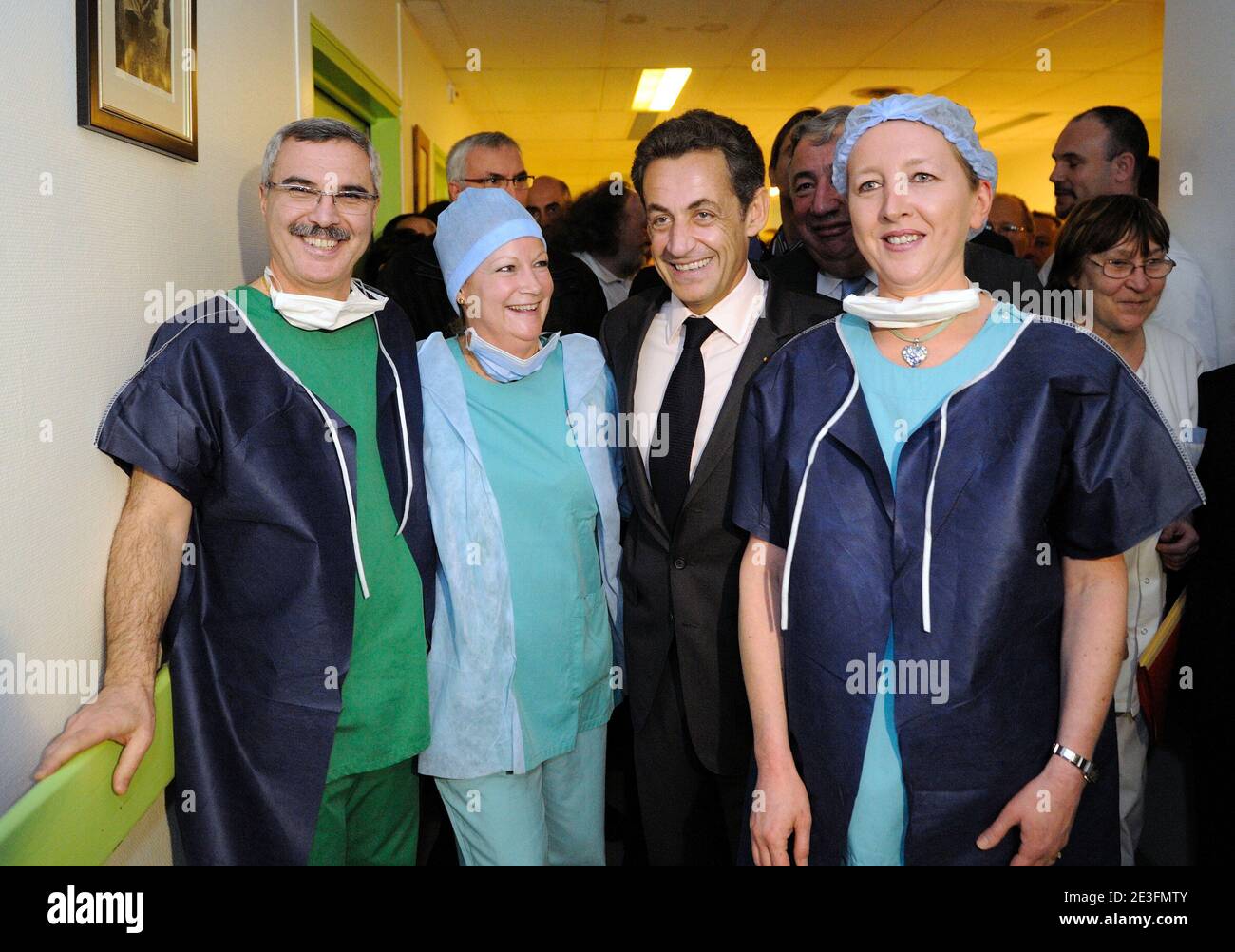 French President Nicolas Sarkozy poses with employees during his visit at the Rambouillet hospital, Paris suburb, France on March 13, 2009. Photo by Eric Feferberg/ABACAPRESS.COM Stock Photo