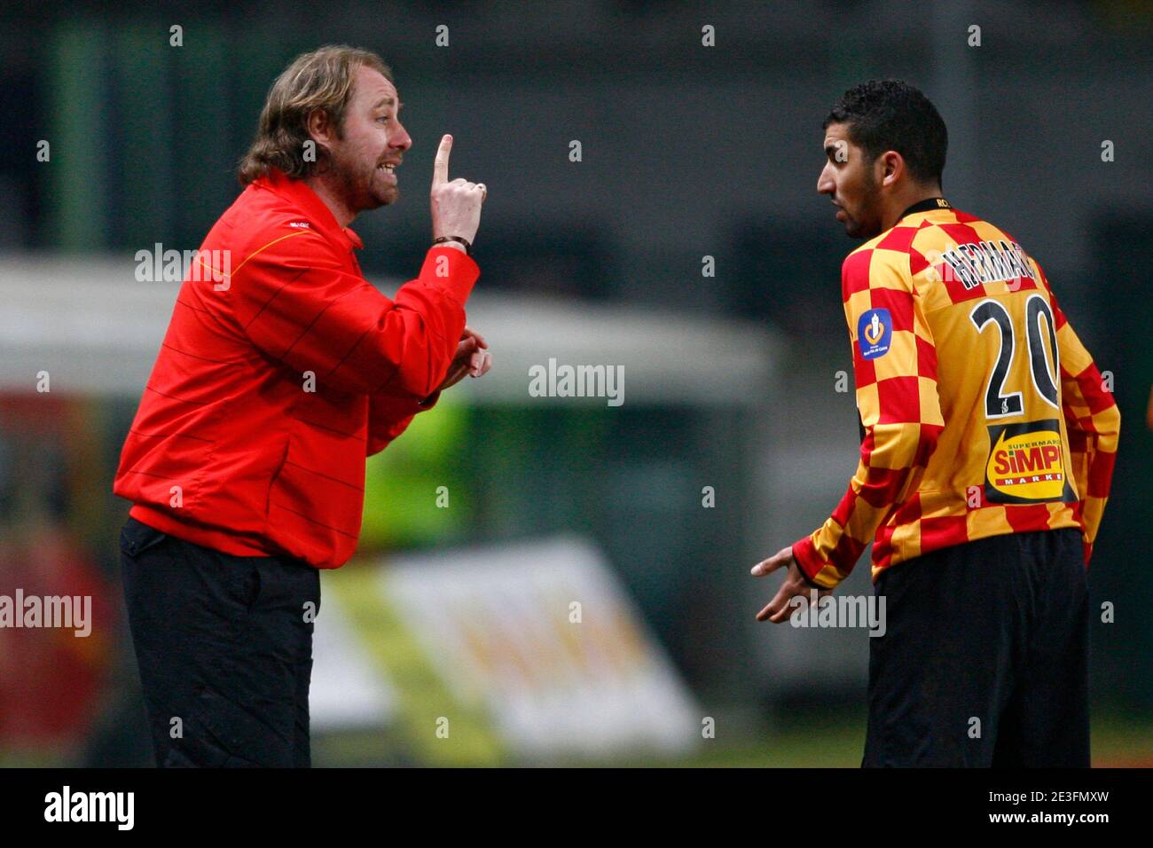 Lens' coach Jean-Giy Wallemne speaks with Adil Hermach during the French  Second League Soccer match, Racing Club de Lens vs AC Ajaccio at the Felix  Bollaert stadium in Lens, France on March