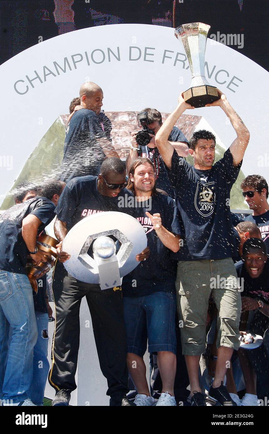 Bordeaux's football team players pose with their trophy at the Quinconces square in Bordeaux, France on May 31, 2009 after they won their French First League Soccer Final match Caen on