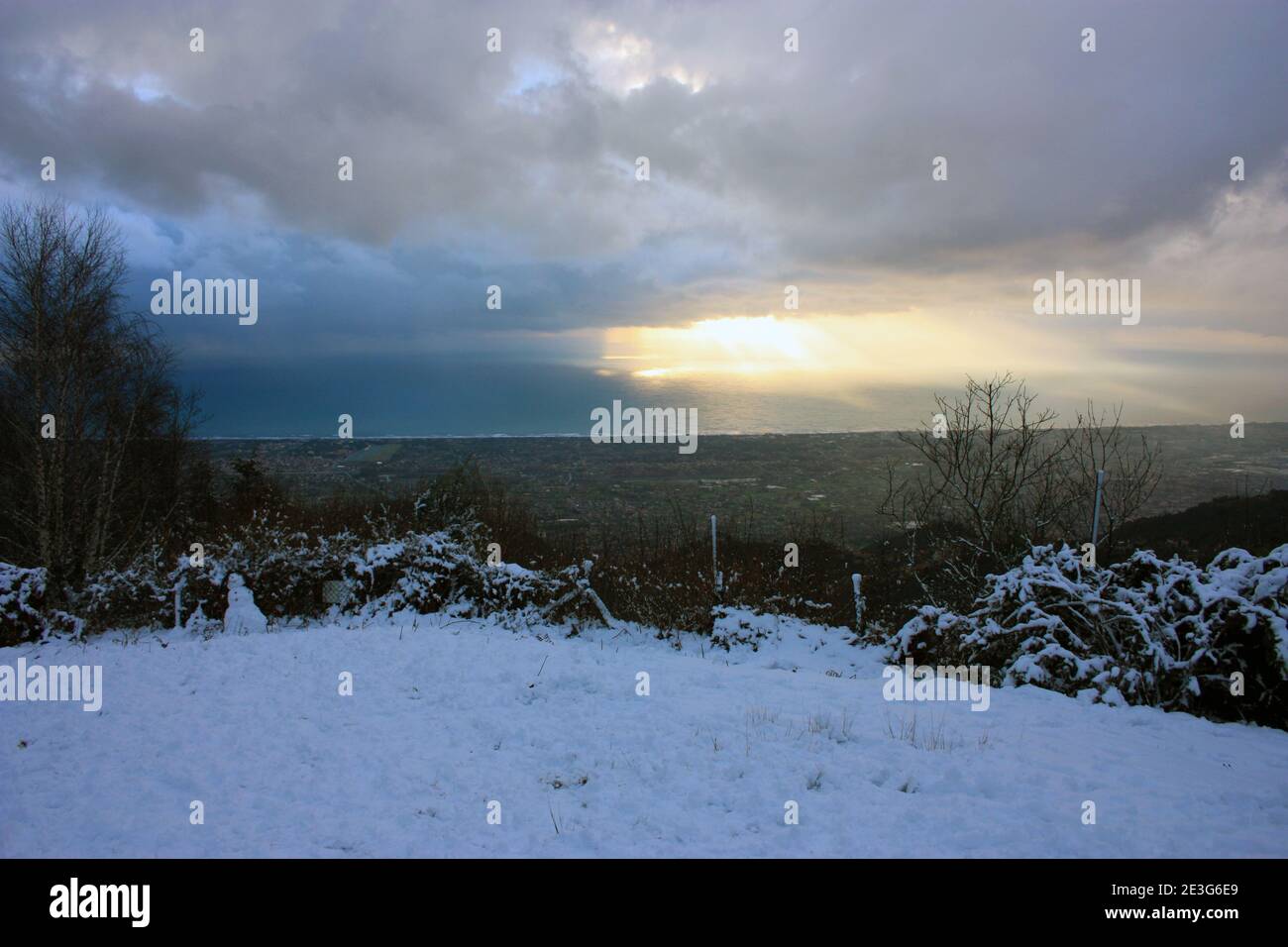 winter panorama from the sea of the Versilia coast to the white snow capped mountains in tuscany from pasquilio Stock Photo