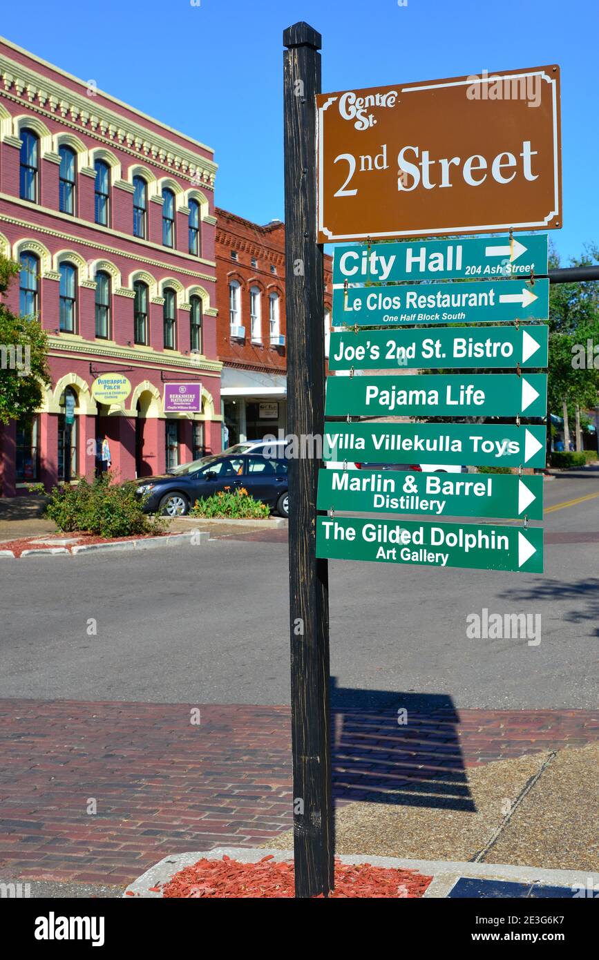 A post with directional signs for downtown galleries,  shops and City Hall, in historic Fernandina Beach, on Amelia Island, Florida Stock Photo