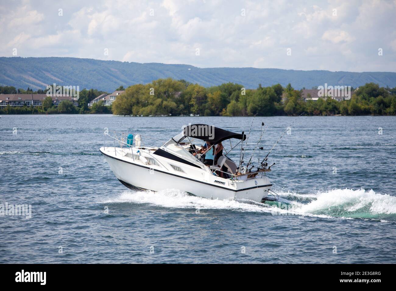 A small fishing boat returns to the Collingwood Harbor after a day of