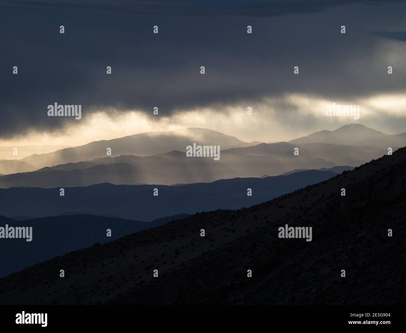 Panorama view of mountain range silhouette layers haze dust fog clouds ...