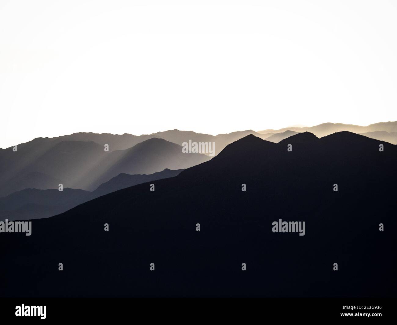 Panorama view of mountain range silhouette layers haze dust fog clouds ...