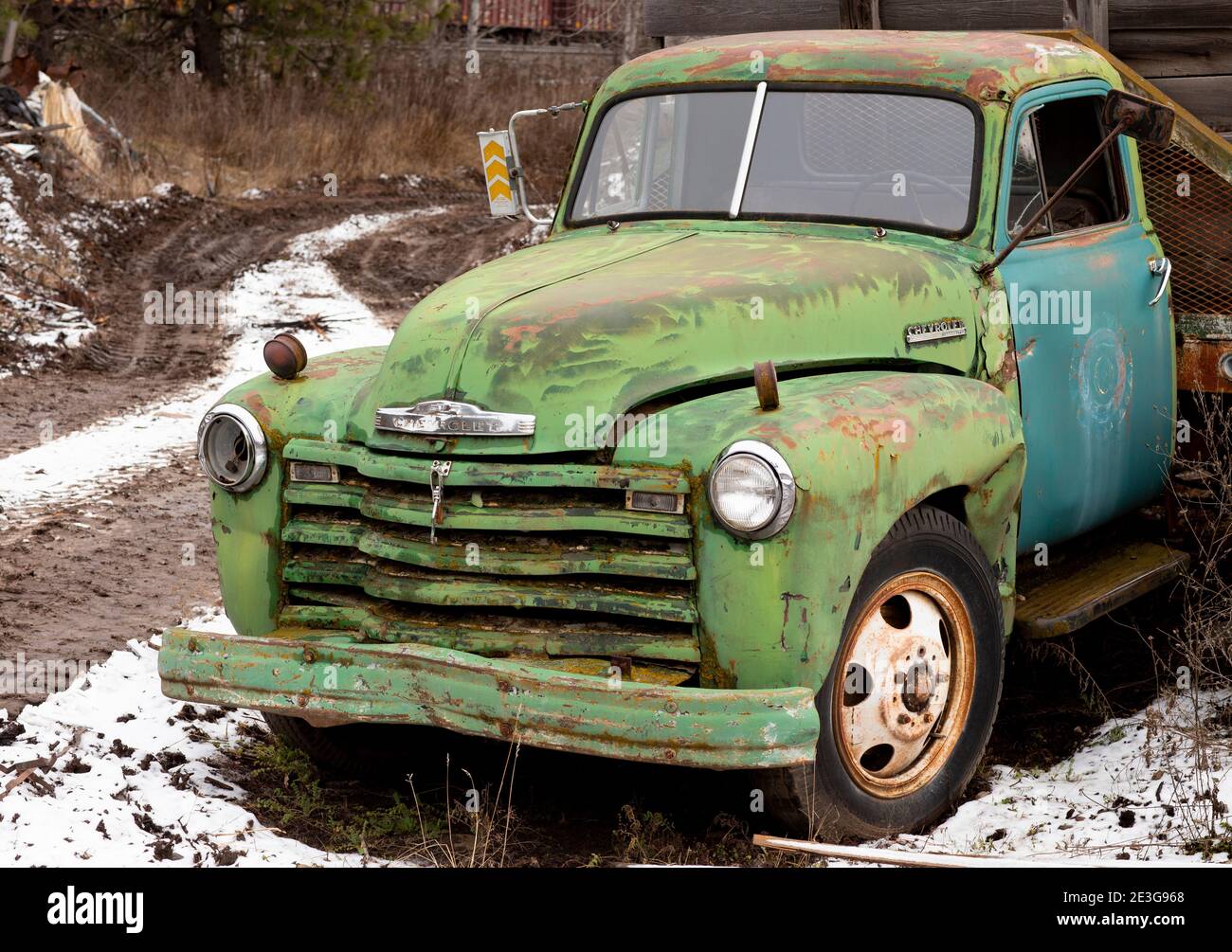 A green, early 1949 Chevrolet Loadmaster 1 ton stake-body work truck, at a sawmill, in Troy, Montana, USA.  Chevrolet Advance-Design cab trucks were m Stock Photo