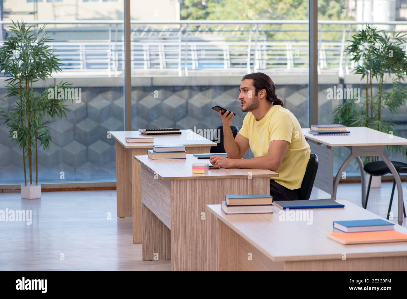 Male student sitting in the classroom Stock Photo - Alamy