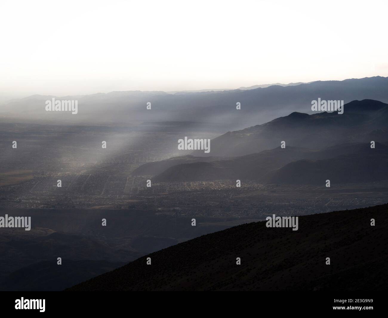 Panorama view of mountain range silhouette layers haze dust fog clouds ...