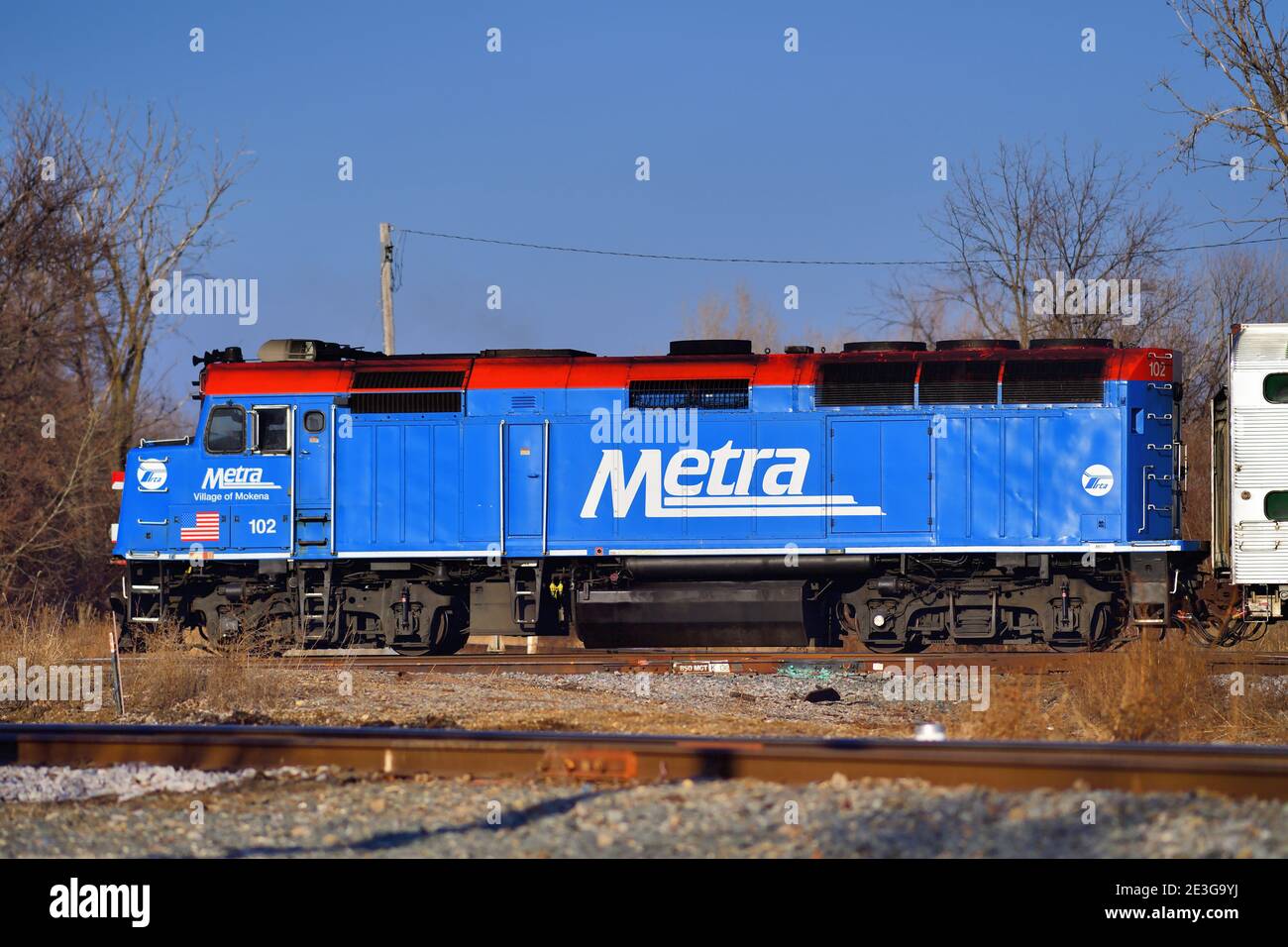 Bartlett, Illinois, USA. An outbound Metra commuter train crossing tracks  owned by the Canadian National Railway Stock Photo - Alamy