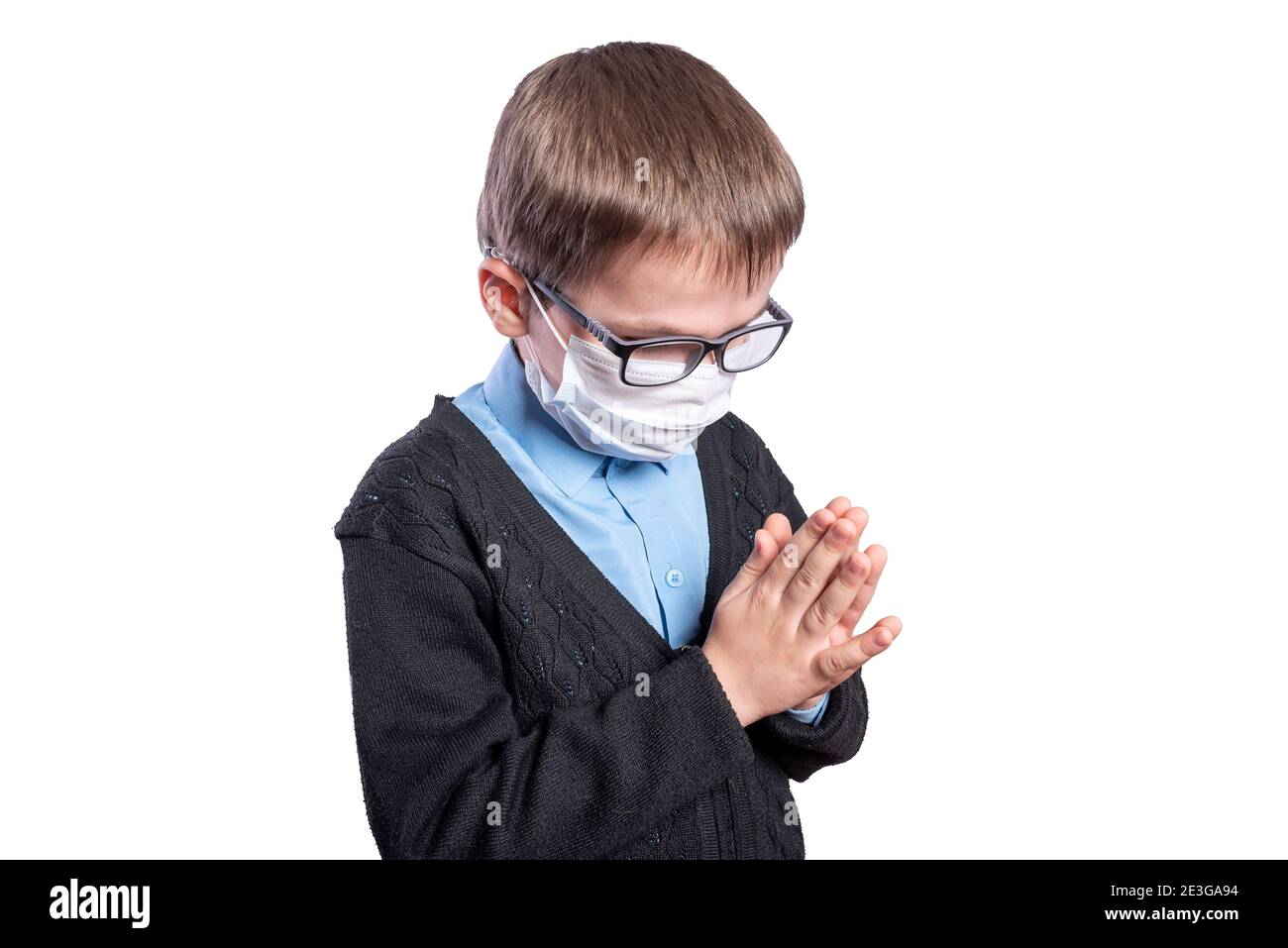 The boy in the mask is praying. Isolated on white background. High quality photo Stock Photo Alamy