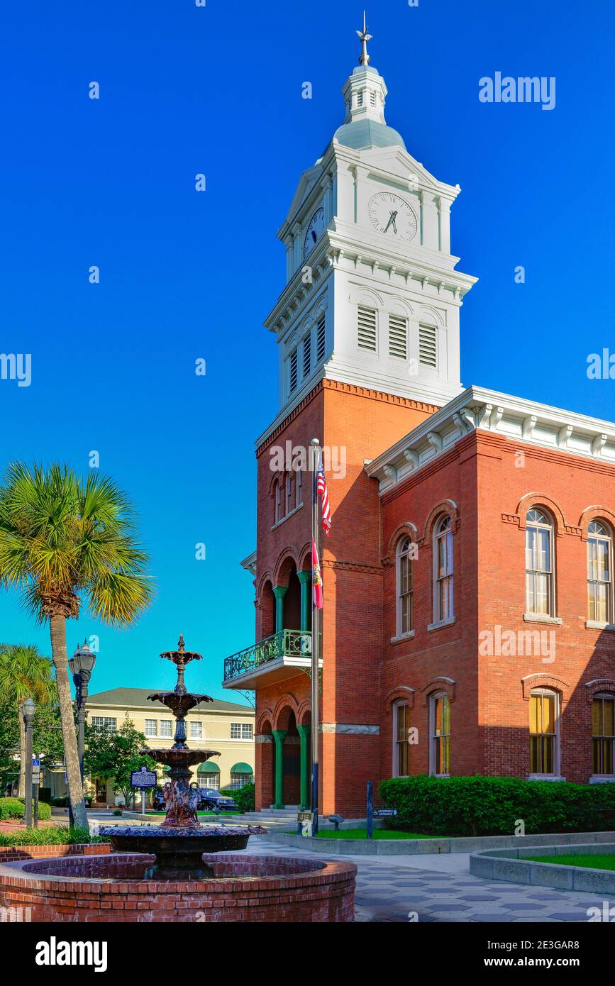 Classical Revival architecture of the Nassau County Courthouse with bell tower, steeple and fountain in historic Fernandina Beach, FL on Amelia Island Stock Photo
