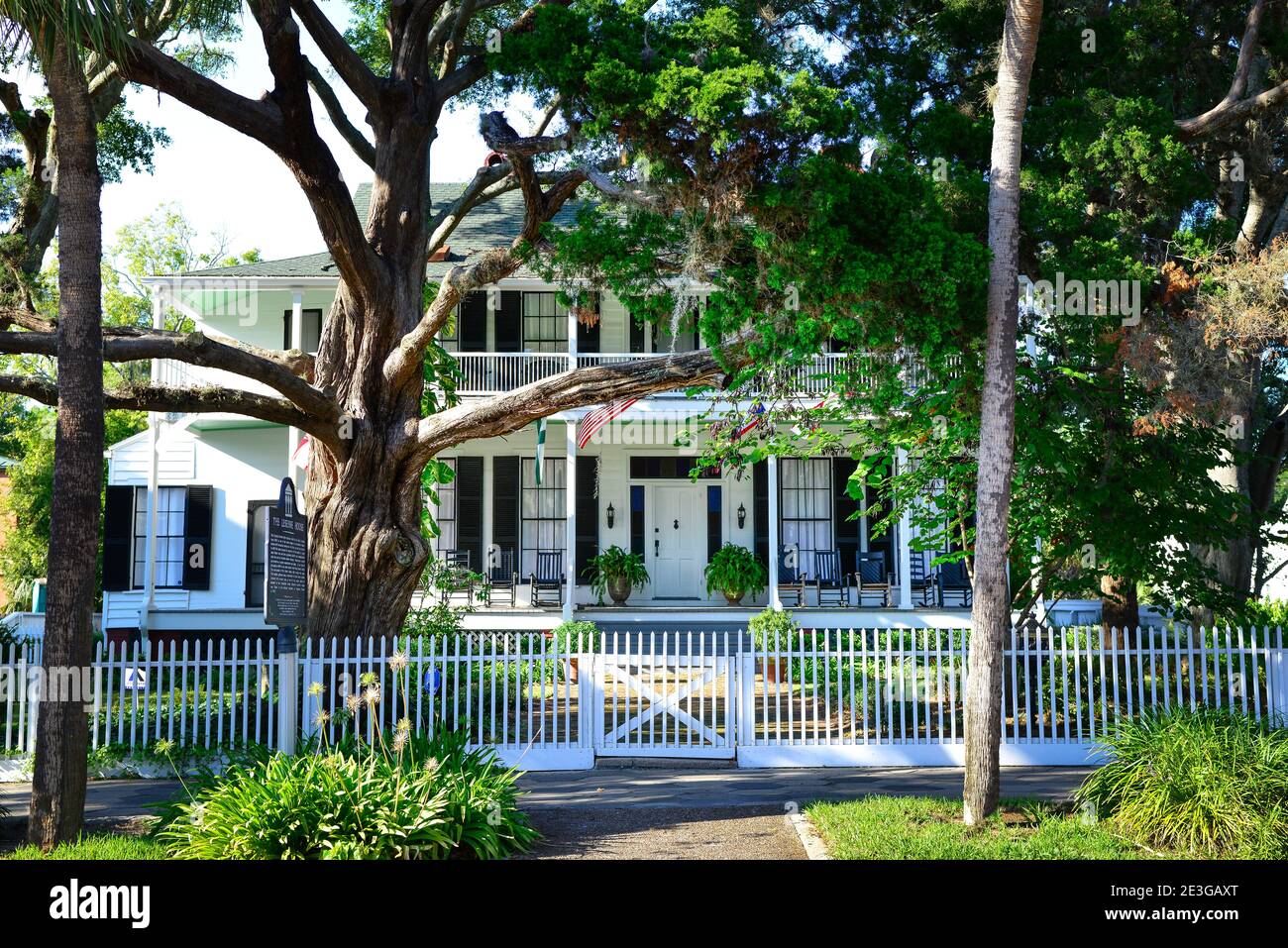 The beautiful, historic Greek Revival style 'Lesesne House' with porch and rocking chairs in Fernandina Beach, FL on Amelia Island Stock Photo