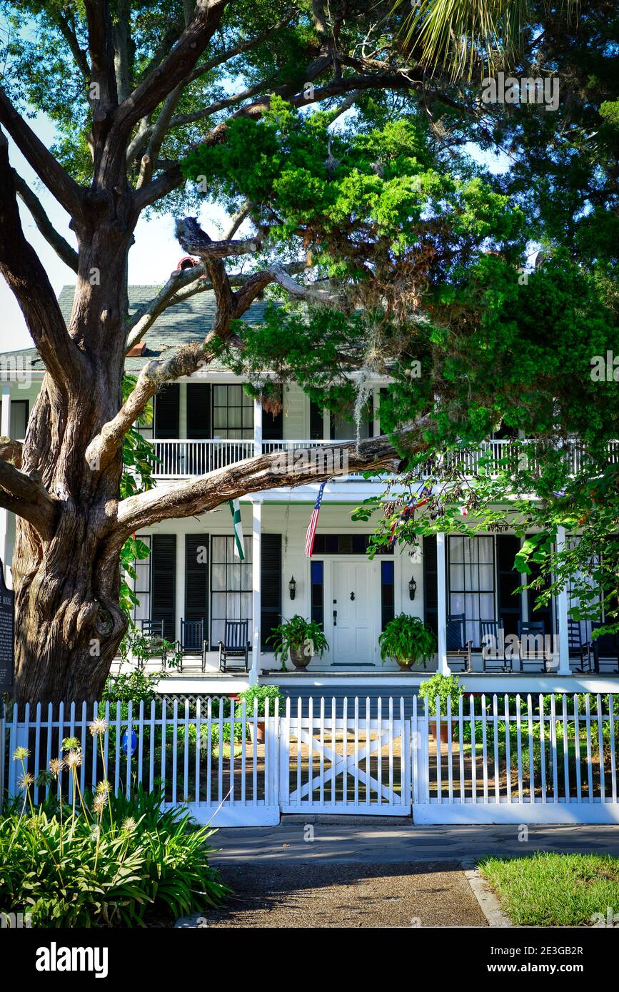 The beautiful, historic Greek Revival style 'Lesesne House' with porch and rocking chairs in Fernandina Beach, FL on Amelia Island Stock Photo