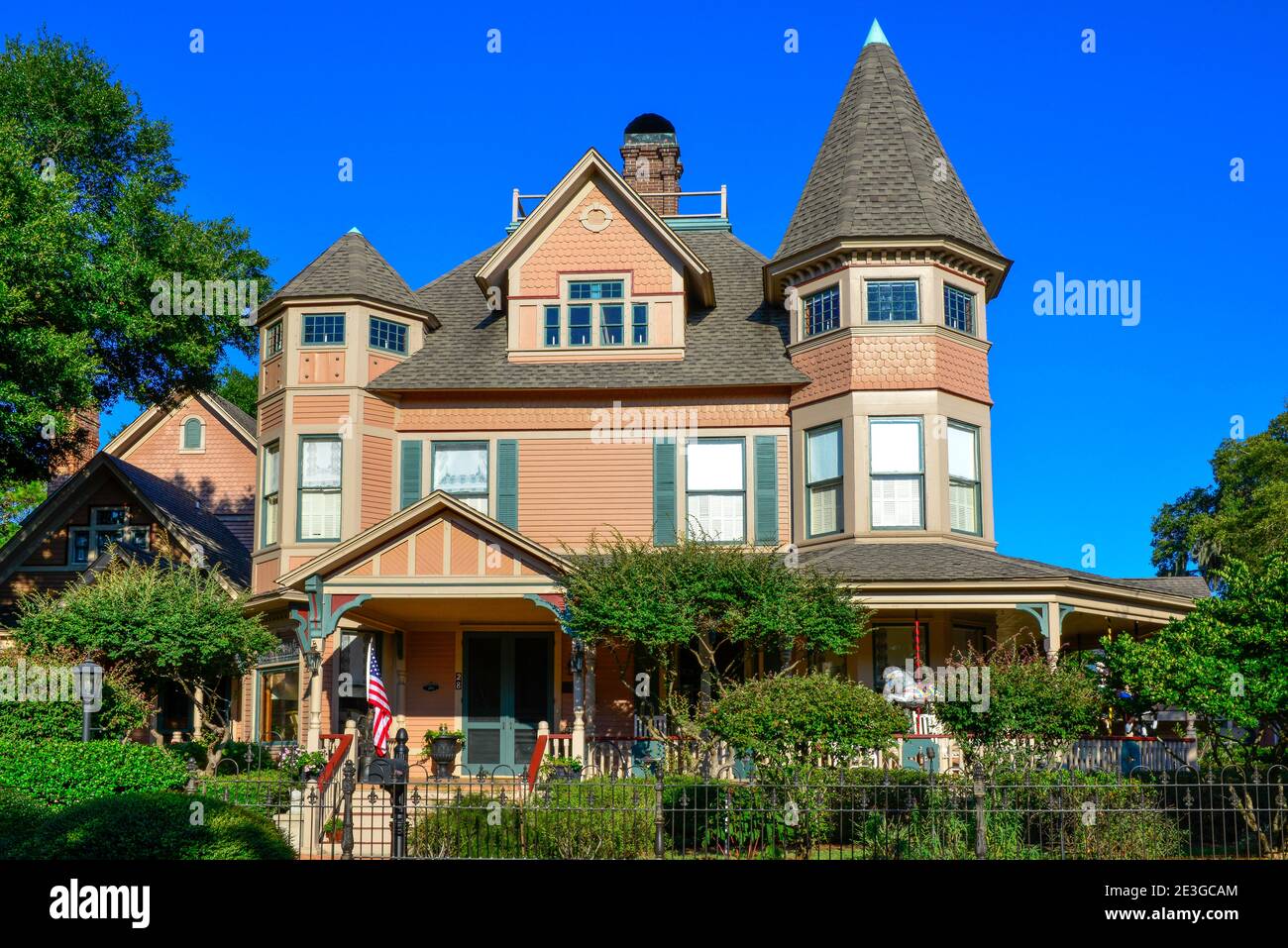 The historic Bailey House, is a Victorian Queen Anne style with a display of antique carousel horses on front porch, in Fernandina Beach, FL on Amelia Stock Photo