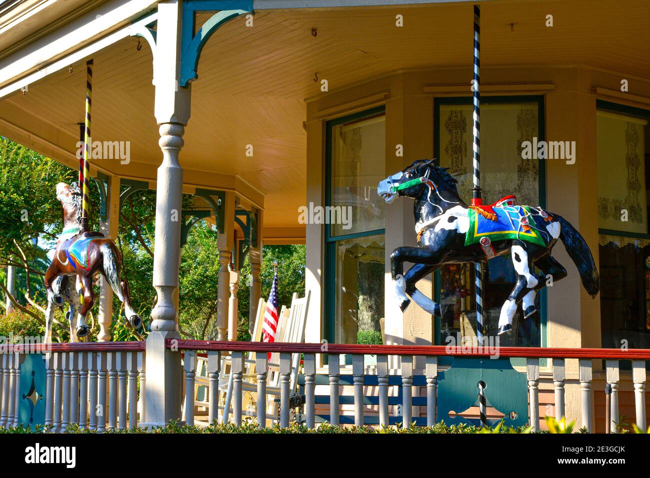 Close up of  an antique carousel horse displayed on the front porch of the  Victorian Queen Anne style Bailey House in Fernandina Beach, FL on Amelia Stock Photo