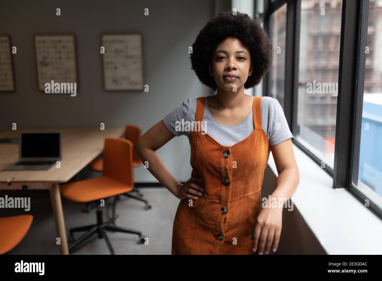 Mixed race businesswoman working in creative office Stock Photo