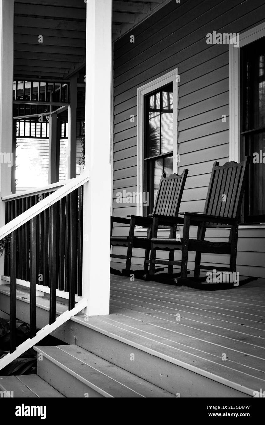 Close up of Southern Hospitality with Rocking chairs on the front porch of a two-storied Inn in Fernandina Beach on Amelia Island, FL Stock Photo