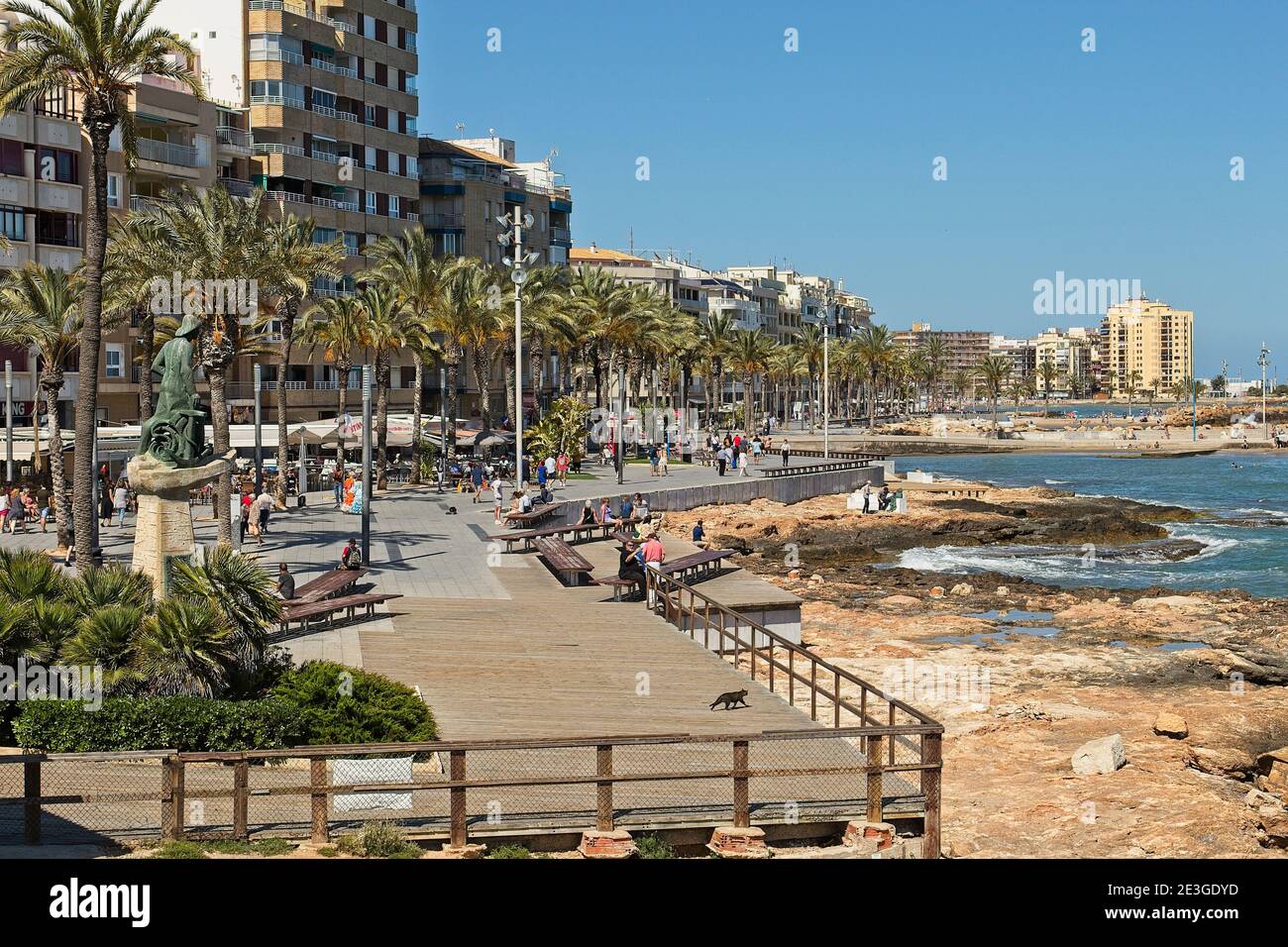 Torrevieja, Spain. View from the harbour wall steps of the promenade 'Paseo Juan Aparicio'. Along here are many bars and restaurants as well as shops Stock Photo
