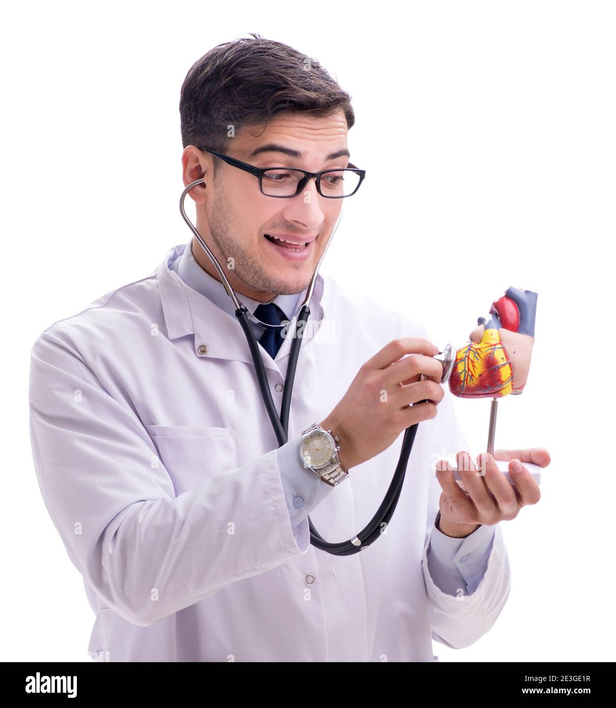The young doctor with heart shape isolated on white Stock Photo - Alamy