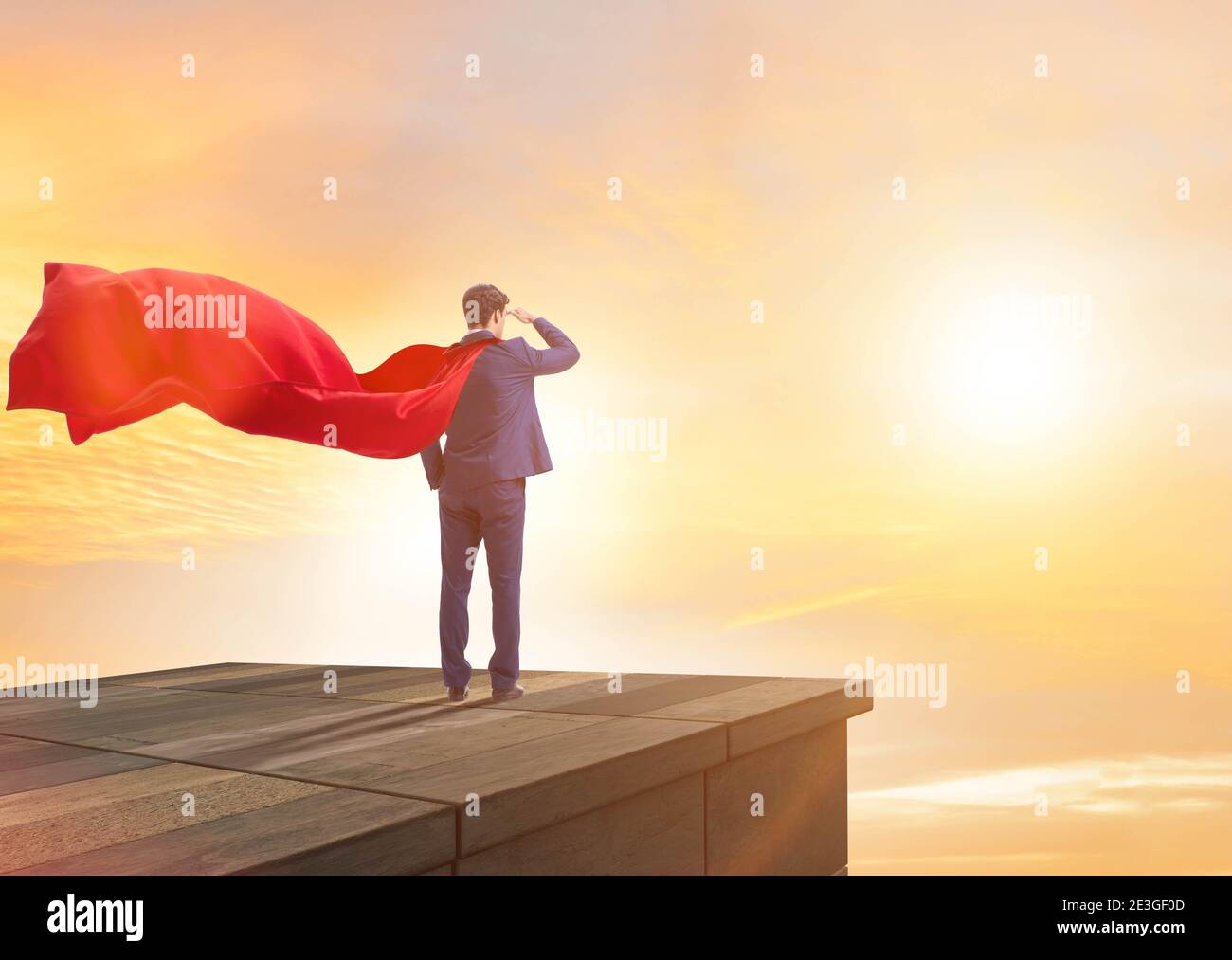 The super hero businessman on top of building ready for challenge Stock ...