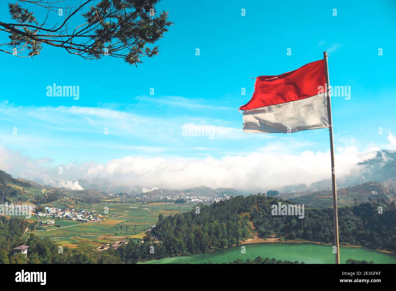 Indonesian Flag on Telaga Warna lake and mountain in Dieng Indonesia ...