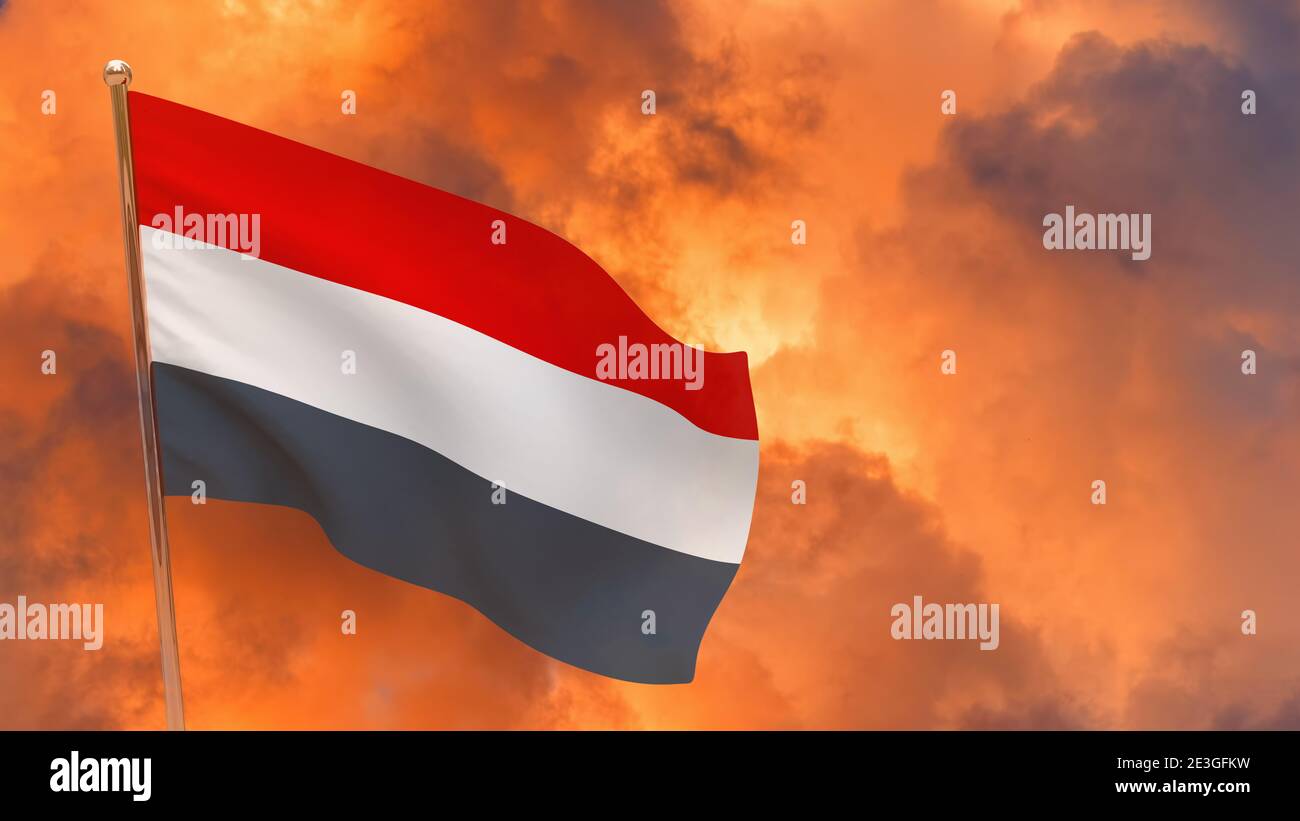 Yemen flag on pole. Dramatic background. National flag of Yemen Stock