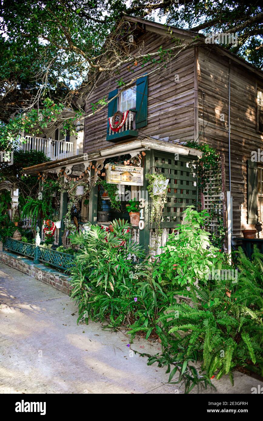 An artistic garden with birds' nest at the eclectic Dove Cote Garden shop, with sign and front porch in historic Fernandina Beach, Amelia Island, FL Stock Photo