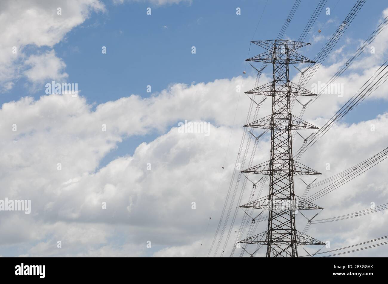 Hight Voltage Pole and the Blue Sky with Clouds Stock Photo - Alamy