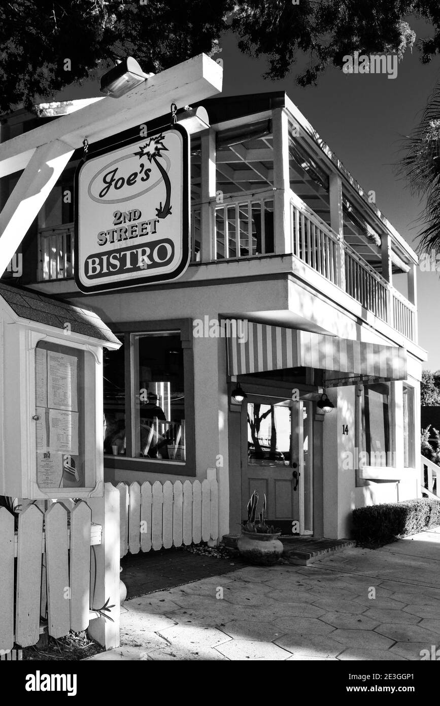The old Florida style craftsman building with charming accents houses Joe's 2nd Street Bistro in Fernandina Beach, FL, on Amelia Island, USA, in B & W Stock Photo